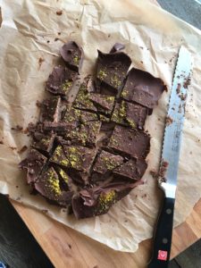 Chocolate bars melted and chilled in natural parchment paper - easyveganmealprep.com