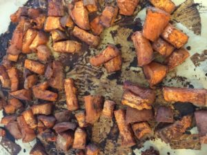 Sweet potatoes roasted on natural parchment paper - easyveganmealprep.com