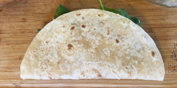 Tortilla can be folded in half or into a burrito shape.